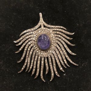 Cabochon tanzanite and diamond feather pendant